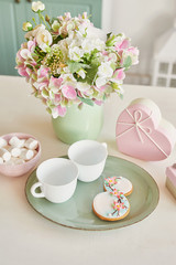 Gingerbreads for March 8 in the bright kitchen with flowers