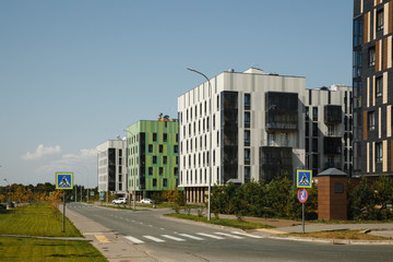Fototapeta na wymiar Innopolis, Russia - August 30 , 2018: New modern apartment buildings under construction with cranes. Innopolis - innovative city in Tatarstan