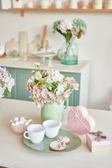 Gingerbreads for March 8 in the bright kitchen with flowers