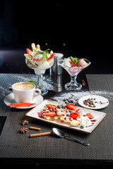 Various desserts: waffles, cream, coffee, ice cream. Sweet snacks. Dessert menu