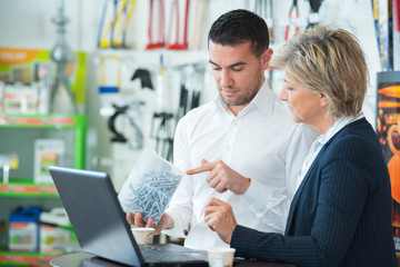 man holding jar full of screw