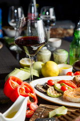 glass of dry red wine in a beautiful glass. Georgian cuisine. Georgian wine.