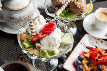 Espresso and homemade ice cream in the restaurant: strawberry, vanilla, citrus. Delicious and fresh dessert.