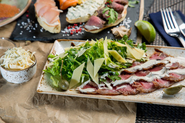 Sandwiches with salted salmon and cottage cheese. Bruschetta with various toppings