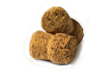Corks from champagne wine and muselets. Isolated on white background with copyspace. View from above.