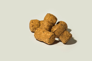 Corks from champagne wine and muselets. Isolated on white background with copyspace. View from above.