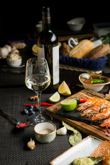 White wine stands next to the bottle. Snacks for white wine in the restaurant. Georgian restaurant
