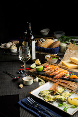 White wine stands next to the bottle. Snacks for white wine in the restaurant. Georgian restaurant