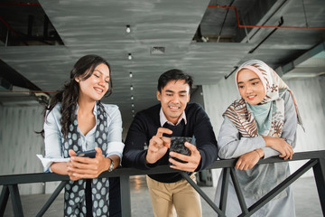 group of office friends chatting about most trending topic in the world