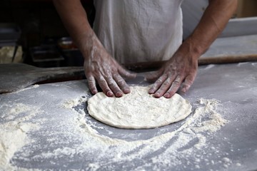 pide master makes pide with meat and vegetables .artvin/turkey