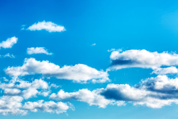 Naklejka na ściany i meble Bright turquoise sky with clouds, background