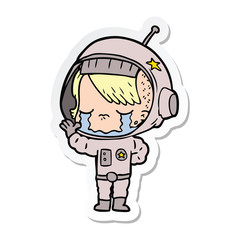 sticker of a cartoon crying astronaut girl