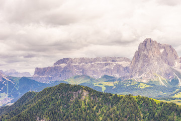 Alpe di Siusi, Seiser Alm with Sassolungo Langkofel Dolomite, a canyon with a mountain in the background