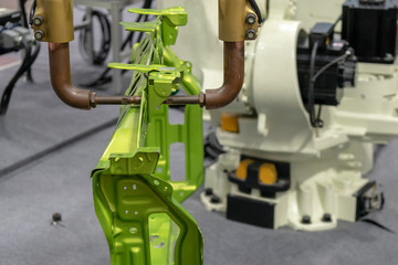The robotic arm spot welding the automotive  parts. The hi-technology automotive part manufacturing...