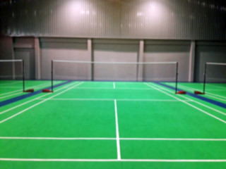 blurred background green badminton court