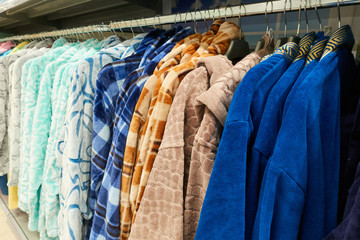 Bathrobes on hangers in the clothing store