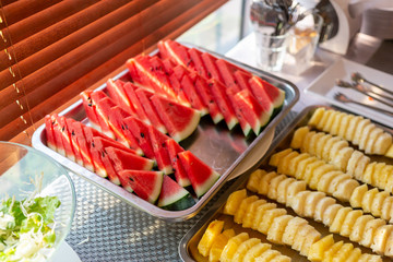 Watermelon and pineapple cut into pieces for breakfast