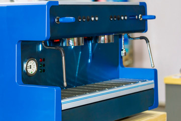 close up modern and automatic blue color of coffee machine