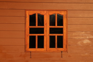 Obraz na płótnie Canvas Windows on wooden house.