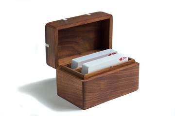 wooden card box with playing cards isolated on white