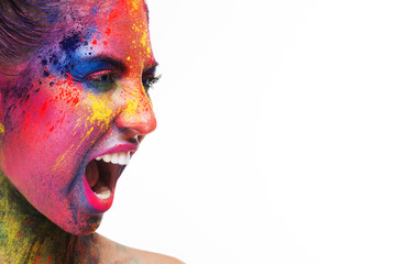 Screaming woman with unusual bright make-up on white
