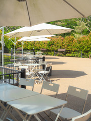 Garden umbrella outdoor with table and chairs in garden