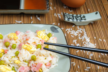 Dish of rice three delicacies and accompanying sauces