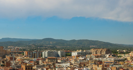 Fototapeta na wymiar Cityscape of Reus, taken from the Prioral de Sant Pere. Shoot in June 2018