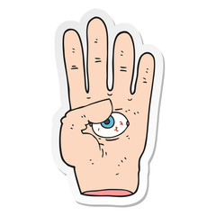 sticker of a cartoon spooky hand with eyeball