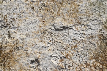 Close up detailed surface of granite and concrete mixed walls in high resolution