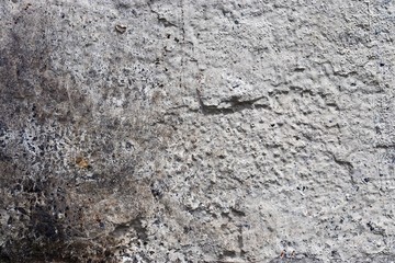Close up detailed surface of granite and concrete mixed walls in high resolution