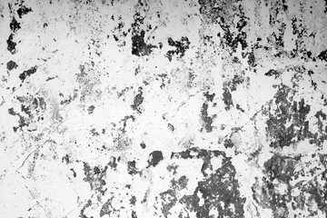 Сraked weathered cement wall texture in black and white.