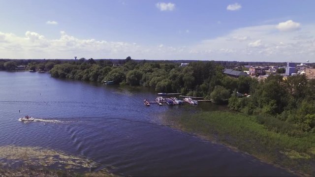 Aerial drone footage of a boat on Lake Irvine, along with the dock and shoreline.