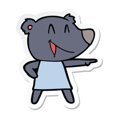 sticker of a cartoon bear in dress laughing and pointing