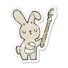 distressed sticker of a cartoon rabbit with paint brush