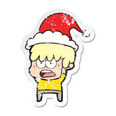 worried distressed sticker cartoon of a boy wearing santa hat