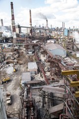 landscape, panorama, view of factory slums with metal hulls and machines for the production of the coking industry, smoking pipes and reconstruction of a plant in Ukraine