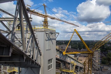 landscape, panorama, view of factory slums with metal hulls and machines for the production of the coking industry, smoking pipes and reconstruction of a plant in Ukraine