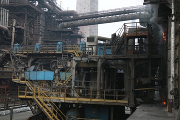 landscape, panorama, view of factory slums with metal hulls and machines for the production of the...