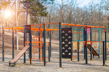 Street sports ground gym at the forest with green pines open air