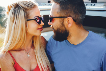 Beautiful couple spend time in a summer park