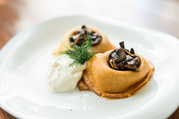 baked pancakes with mushrooms and sour cream