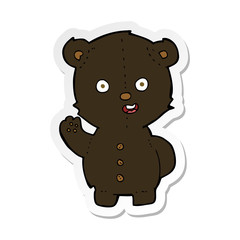sticker of a cute cartoon black bear