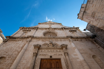 Fototapeta na wymiar Facade of the Church of San Domenico (Chiesa di San Domenico) in the old town of Monopoli, Puglia, Italy. Region of Apulia