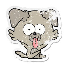 distressed sticker of a cartoon dog with tongue sticking out