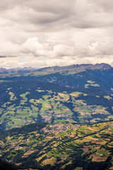 Obraz premium Alpe di Siusi, Seiser Alm with Sassolungo Langkofel Dolomite, a close up of a lush green field in a valley canyon
