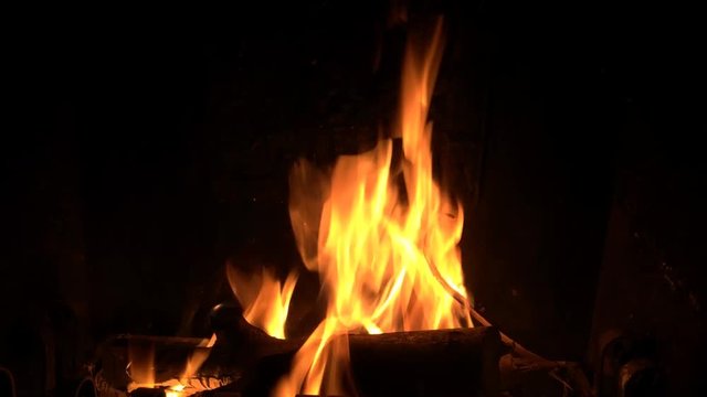 clinking log fire burning in a fireplace brazier - HD natural light