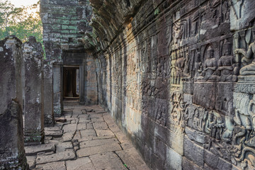 Fototapeta premium Relief on the wall of gallery of Bayon temple in Angkor Thom. Cambodia