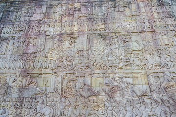 Relief on the wall of gallery of Bayon temple in Angkor Thom. Cambodia