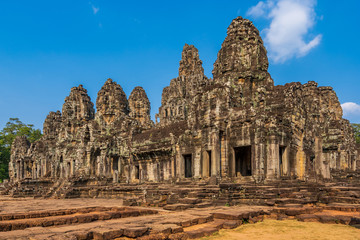 Fototapeta na wymiar Bayon temple in Angkor Thom, Cambodia: first enclosure wall, galleries and face towers. West facade